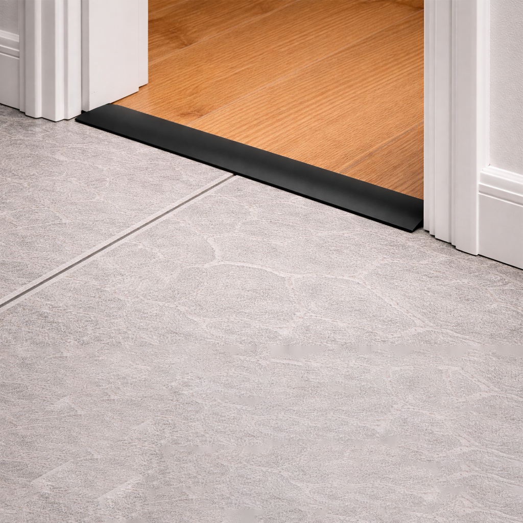 A04 49mm anodised aluminium door threshold strip installed at doorway joint