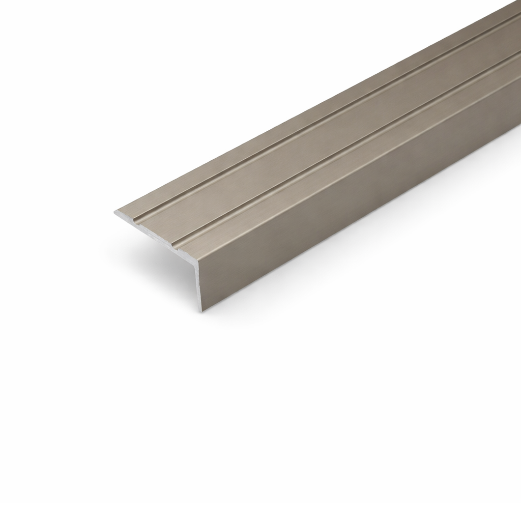 Champagne A31 25x10mm anodised aluminium self adhesive stair nosing edge trim installed on indoor staircase for slip protection