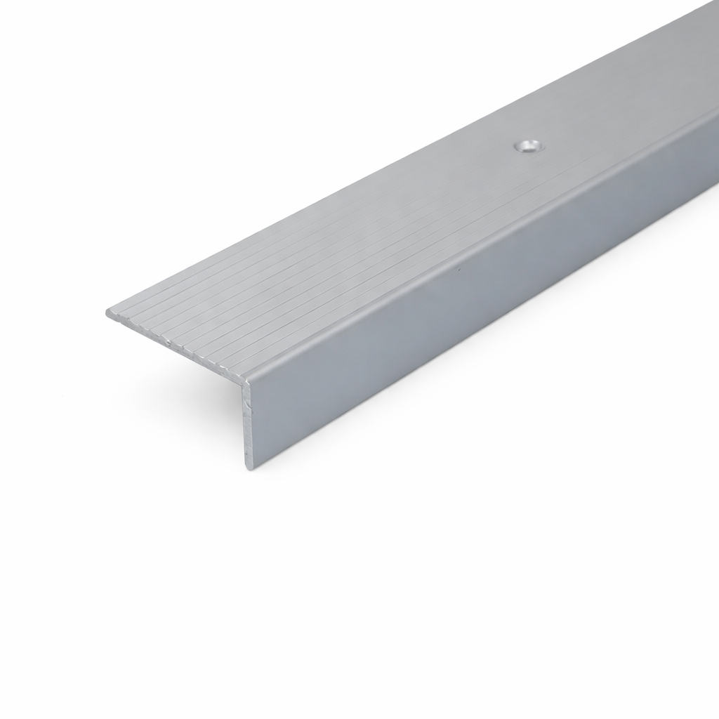 Silver A33 40x20mm anodised aluminium non-slip ribbed stair nosing edge trim installed on staircase steps