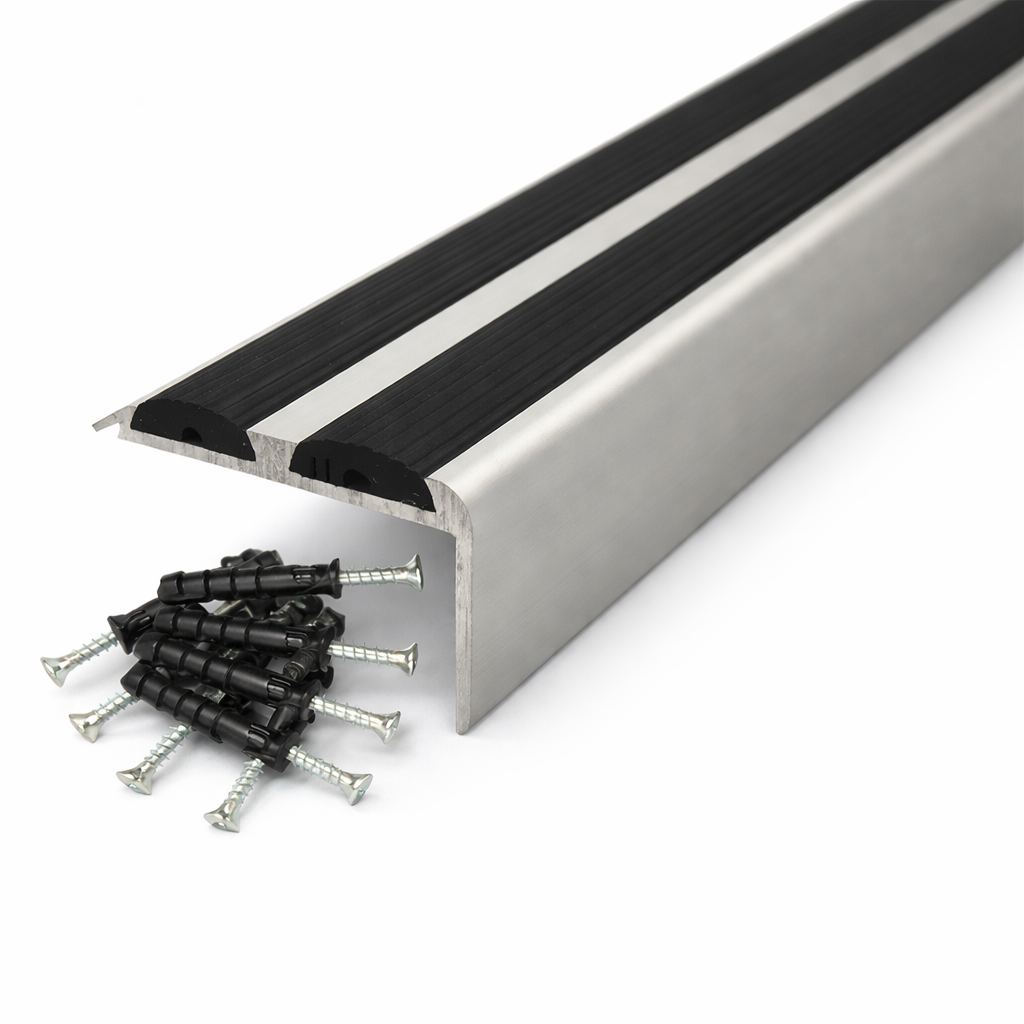 Silver Anodised aluminium stair nosing with rubber inserts installed on staircase step