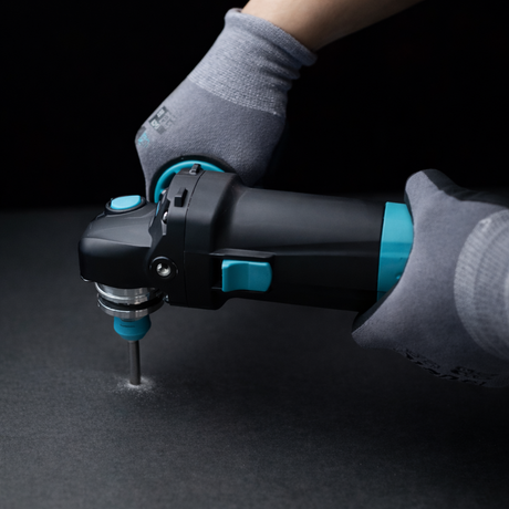 1200W angle grinder variable speed performing drilling operation using compatible attachment