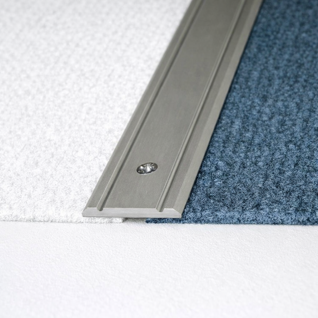 A02 flat aluminium door threshold strip fitted to cover floor expansion gap