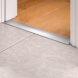 Anodised aluminium 30mm self adhesive door threshold strip installed between rooms