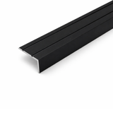 Black A31 25x10mm anodised aluminium self adhesive stair nosing edge trim installed on indoor staircase for slip protection