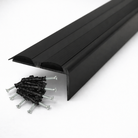 Black Anodised aluminium stair nosing with rubber inserts installed on staircase step