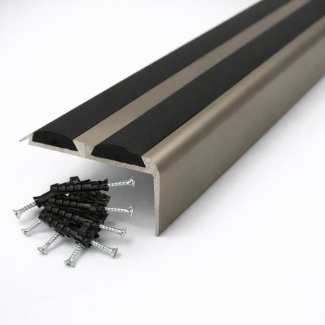 Champagne Anodised aluminium stair nosing with rubber inserts installed on staircase step