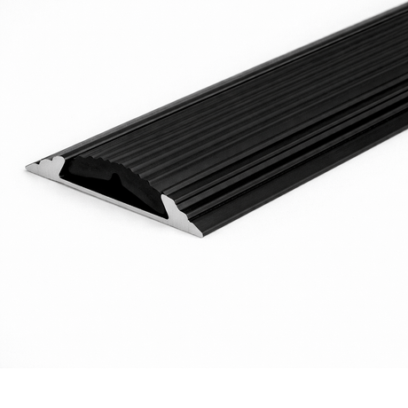 Black A10 anodised aluminium flat non-slip threshold strip installed between two floor surfaces for added safety.