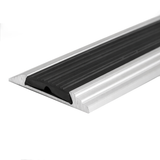 Silver A10 anodised aluminium flat non-slip threshold strip installed between two floor surfaces for added safety.