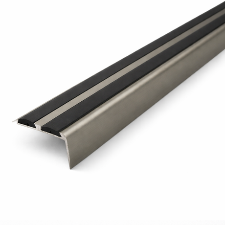 Inox Anodised aluminium stair nosing with rubber inserts installed on staircase step