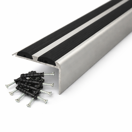 Silver Anodised aluminium stair nosing with rubber inserts installed on staircase step