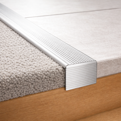 A34 stair nosing trim installed on concrete steps using self adhesive backing