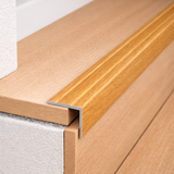 A36 aluminium wood effect self adhesive stair nosing installed on indoor stairs