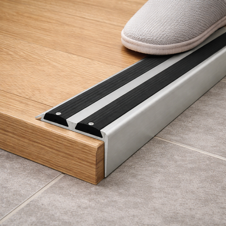 Usage Anodised aluminium stair nosing with rubber inserts installed on staircase step