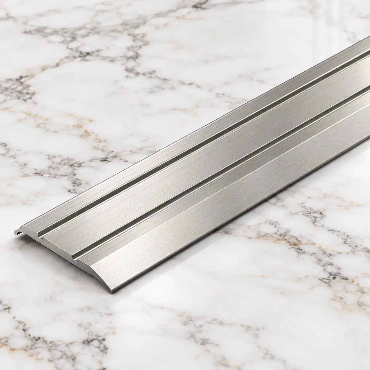 Inox A12 25mm anodised aluminium flat door threshold strip with a slim profile for neat floor transitions.