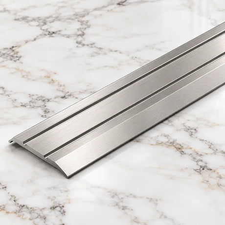 Inox A12 25mm anodised aluminium flat door threshold strip with a slim profile for neat floor transitions.